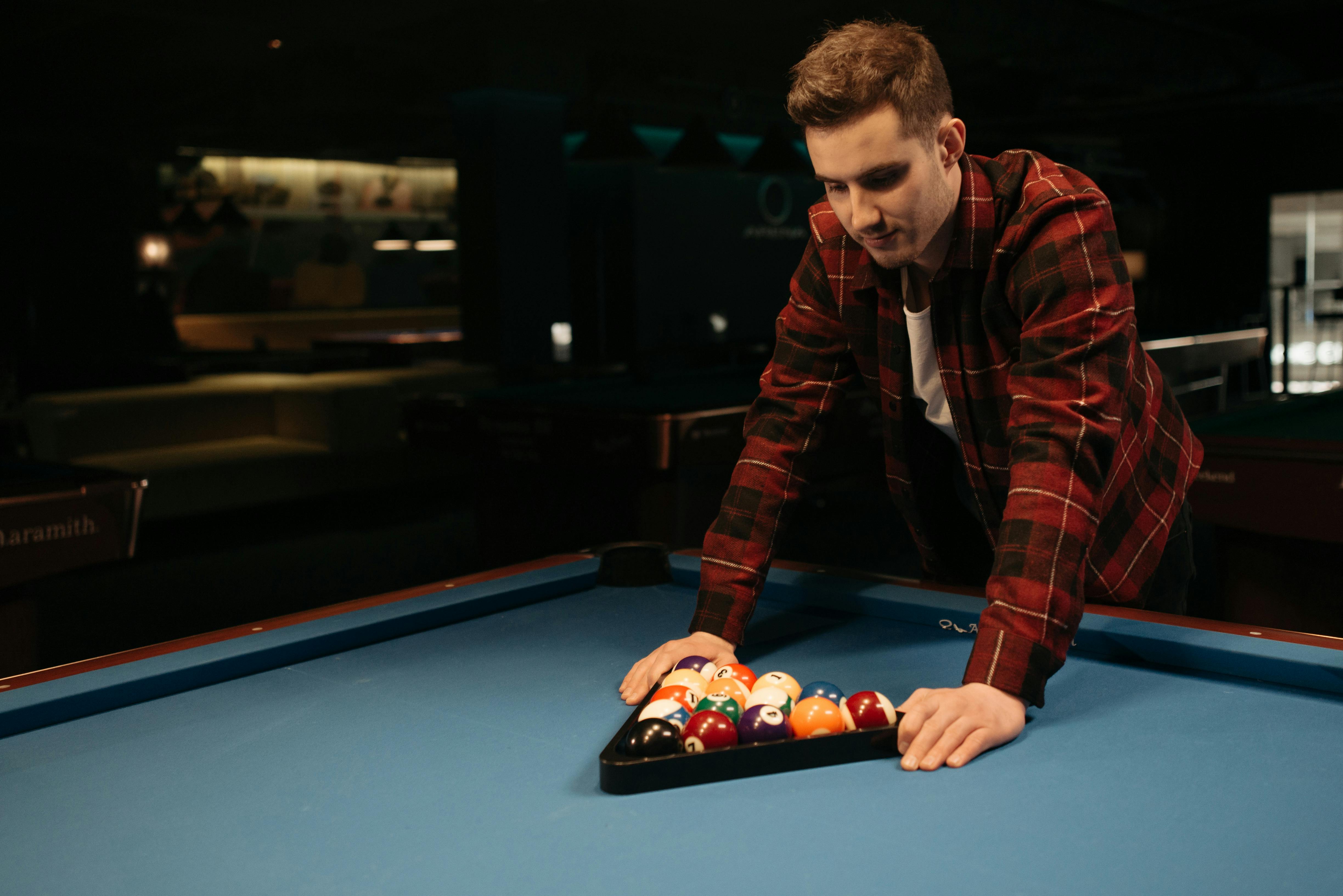 Pool table with balls on blue felt